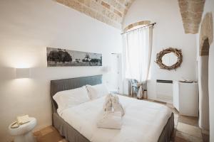 Un pat sau paturi într-o cameră la Giovì Relais
