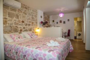 Postel nebo postele na pokoji v ubytování Apartments Seka