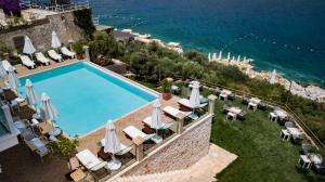 an image of a swimming pool at a resort at Suna Sun Hotel - Adult Only in Kaş