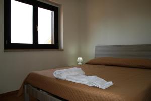 Postel nebo postele na pokoji v ubytování Portoada Park Villas