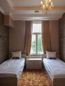 Un pat sau paturi într-o cameră la Villa Kadriorg Hostel