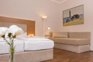 Postel nebo postele na pokoji v ubytování T3 Hotel Cityloft