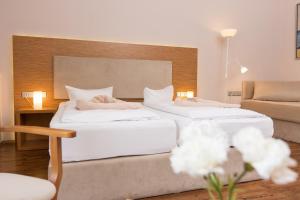 Postel nebo postele na pokoji v ubytování T3 Hotel Cityloft