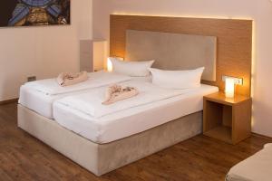 Postel nebo postele na pokoji v ubytování T3 Hotel Cityloft
