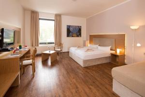 Postel nebo postele na pokoji v ubytování T3 Hotel Cityloft