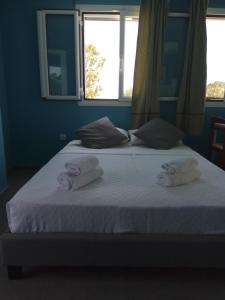 Voodi või voodid majutusasutuse Monte Blu Holiday Apartment toas