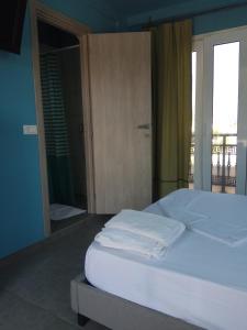 Voodi või voodid majutusasutuse Monte Blu Holiday Apartment toas