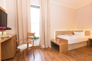 Postel nebo postele na pokoji v ubytování T3 Hotel Cityloft