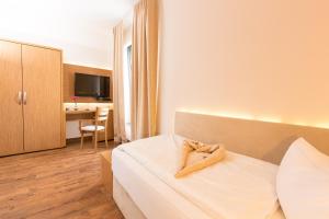 Postel nebo postele na pokoji v ubytování T3 Hotel Cityloft