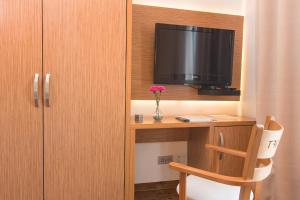 TV a/nebo společenská místnost v ubytování T3 Hotel Cityloft