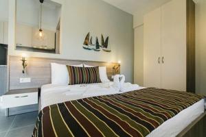 Posteľ alebo postele v izbe v ubytovaní Frangeo boutique rooms