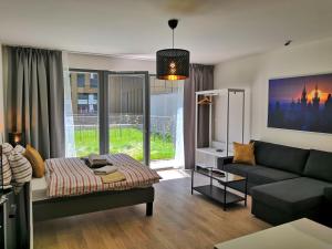 Postel nebo postele na pokoji v ubytování Prima Family Apartments