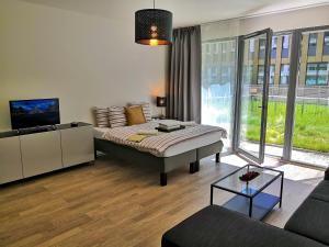 TV a/nebo společenská místnost v ubytování Prima Family Apartments