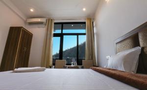 Ένα ή περισσότερα κρεβάτια σε δωμάτιο στο Hotel Tapovan Cottage