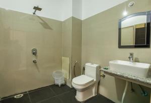 Ένα μπάνιο στο Hotel Tapovan Cottage
