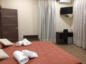 Postel nebo postele na pokoji v ubytování B&B Duomo Apartament