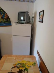 Kuchyň nebo kuchyňský kout v ubytování Casa- Vacanza Giro' - C2A6PEU3OW