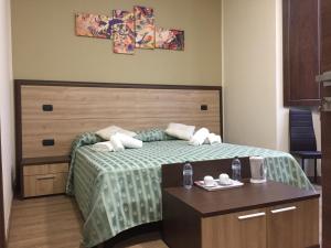 Postel nebo postele na pokoji v ubytování B&B Duomo Apartament
