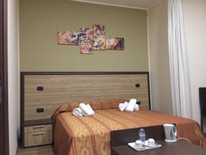 Postel nebo postele na pokoji v ubytování B&B Duomo Apartament