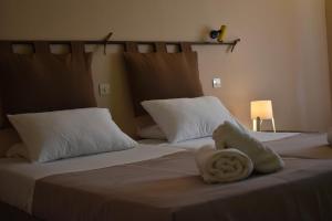A bed or beds in a room at Korina's Apartments