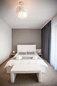 Posteľ alebo postele v izbe v ubytovaní Pensiunea Sada