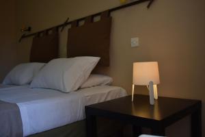 A bed or beds in a room at Korina's Apartments