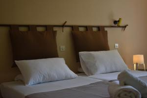 A bed or beds in a room at Korina's Apartments