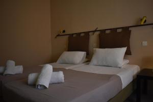A bed or beds in a room at Korina's Apartments