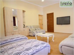 Voodi või voodid majutusasutuse Hotel Iveria toas