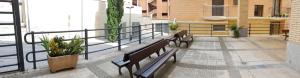 a group of benches sitting on a balcony at Residencial Oscense in Huesca +16 photos