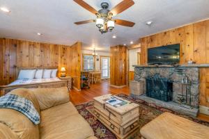 a living room with a couch and a fireplace at Stonebrook Resort - Adult Only in Estes Park