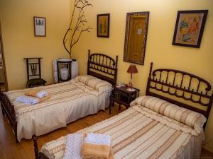 Кровать или кровати в номере Casa rural quiroga