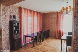 a dining room with a table and chairs at Family Hotel in Daugavpils