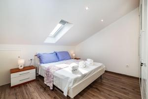 Postel nebo postele na pokoji v ubytování Apartman Dunatov