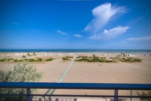 a view of the beach from a balcony at Hotel Continental in Caorle
