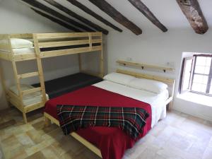 A bed or beds in a room at CASA RURAL REVOLCADORES