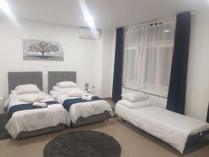 מיטה או מיטות בחדר ב-Marko Airport Rooms