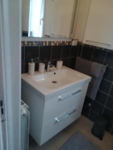 a bathroom with a white sink and a mirror at Casa Melissa in Savio di Ravenna