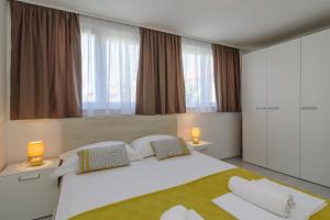 En eller flere senge i et værelse på **Stone House ** Trogir Center ** Old Town + 50 billeder