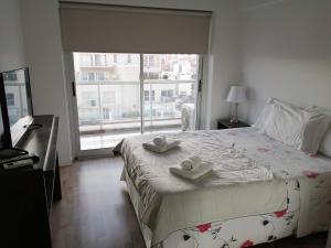 Ein Bett oder Betten in einem Zimmer der Unterkunft Palermo viejo