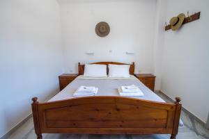 A bed or beds in a room at Irene Hotel Leros