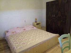 Кровать или кровати в номере Apartman DINKO