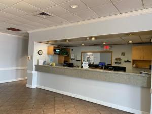 a lobby of a hospital with a reception counter at EZ 8 Motel Airporter in Phoenix