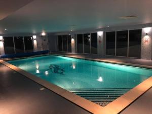 a large swimming pool in a building at 87 Lighthouse View Lodge in Lossiemouth