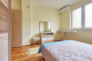 Postel nebo postele na pokoji v ubytování Square Vanilla Apartments