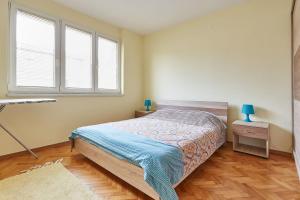 Postel nebo postele na pokoji v ubytování Square Vanilla Apartments