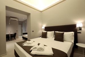 ETNEA STYLE CATANIA LUXURY ROOMS客房内的一张或多张床位