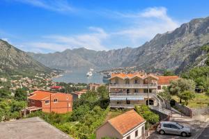 a view of a town with mountains in the background at Apartment Kalle in Kotor
