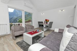 a living room with a couch and a table at Apartment Kalle in Kotor