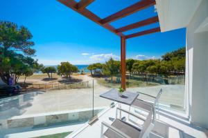 a view of the ocean from the balcony of a house at Sentimento in Prinos